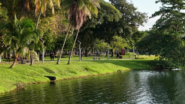 aerial view of kuala lumpur in the background with beautiful morning lark park scenery people jog