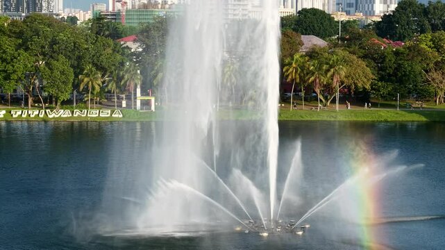 aerial view of kuala lumpur in the background with beautiful morning lark park scenery people jog