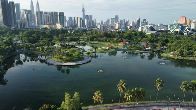 aerial view of kuala lumpur in the background with beautiful morning lark park scenery people jog