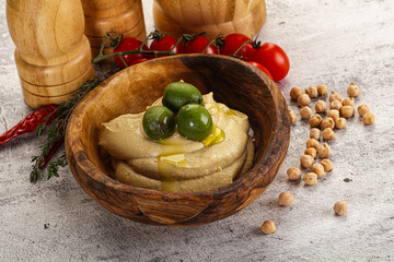 Tasty hummus with green olives