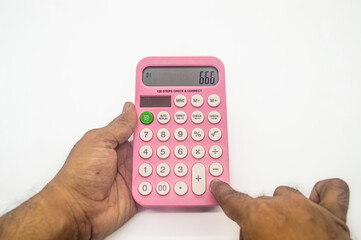 A pink calculator with large buttons and a display showing the number 666. Ideal for educational or office themed visuals