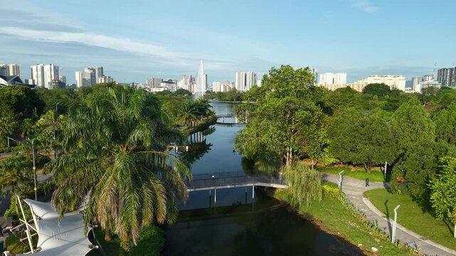 aerial view of kuala lumpur in the background with beautiful morning lark park scenery people jog