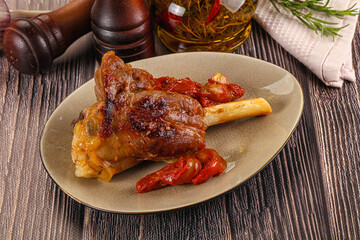 Baked lamb shank with vegetables
