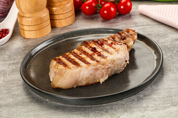 Grilled pork loin steak with bone