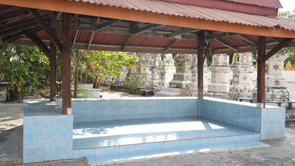 Modern Resting Area Surrounded by Cemetery with Lush Greenery