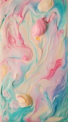 A colorful swirl of frosting on a cake. The frosting is pink, blue, and yellow