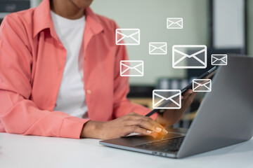 Obraz premium Email notification concept, Female use smartphone and laptop receive message alert in the mailbox.