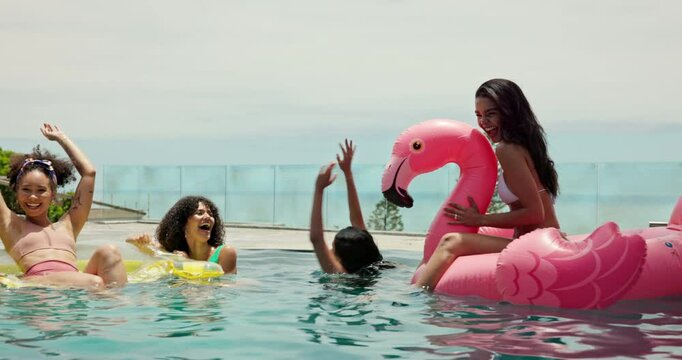 Excited, fun and friends with women at swimming pool for summer celebration, travel and vacation. Happiness, resort and spring break with group of people at party for new year holiday and swimwear