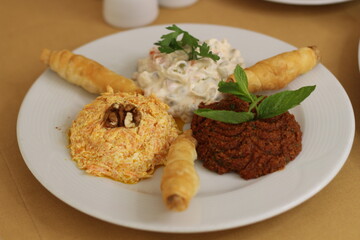 Cooked turkey, rice, nuts and oak plate prepared for Christmas 2024
