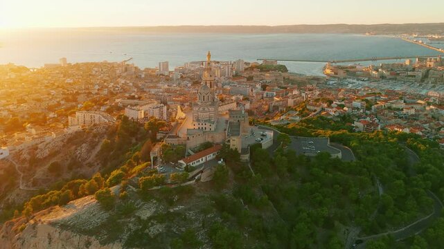 Aerial view of the Notre-Dame de la Garde church at sunset in southern France.