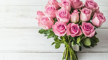 Greeting card mockup with a pink rose bouquet and a matching envelope, styled elegantly on a clean white wooden surface.