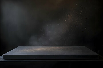 A deep contrast abstract design featuring a matte black surface with floating dust particles gently illuminated from the top right, emphasizing texture and depth