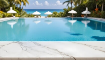 A clear view of a swimming pool with a clear blue water surface in the background. The foreground features a marble countertop. In the distance, there are white umbrellas and palm trees , suggesting a