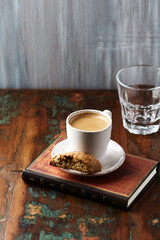 Cup of coffee and Cantuccini (Italian cookie) on dark wooden background. Copy space.	