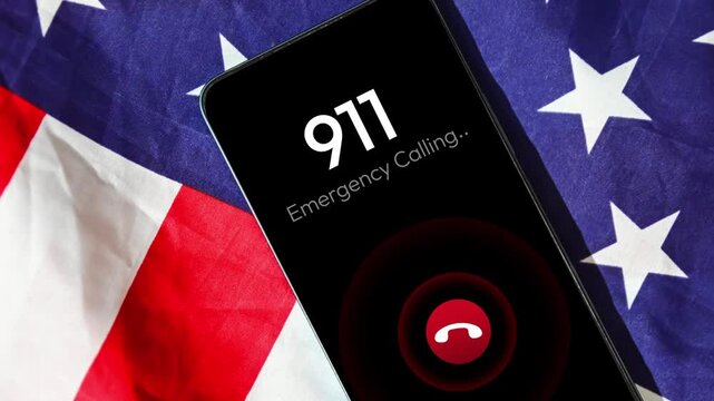 Nine Eleven Emergency Calling Numbers 4k Animation with flag in the backdrop. Dialing 911 on smartphone screen, background.