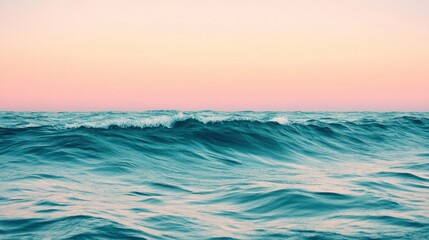 Tranquil Waves Under a Pink-Orange Sky at Dusk Creating a Serene Coastal Atmosphere for Relaxation and Reflection by the Ocean Horizon