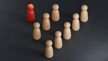 Delegation concept. Wooden human figures with a arrows.Perfect for representing business strategy, leadership, and management.3D rendering on black background.