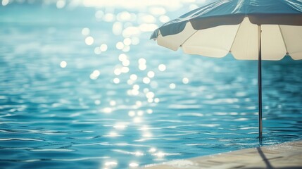 umbrella by the swimming pool, with a gentle breeze rustling the fabric, and the inviting water shimmering in the background