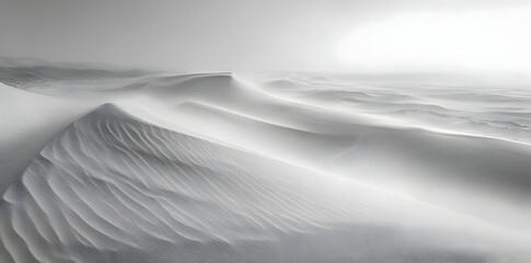 Obraz premium A serene, monochromatic landscape of soft, undulating sand dunes.