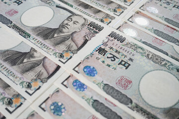 A collection of close-up photos of the Japanese 10,000 Yen banknote