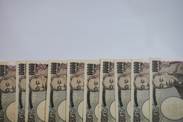 A collection of close-up photos of the Japanese 10,000 Yen banknote
