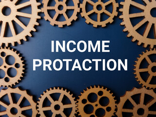 Wooden gear with the word INCOME PROTACTION on a blue background