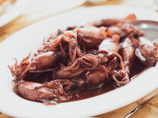 Squid black or Sauteed black squid is processed squid that is cooked until the squid ink is released. The resulting taste is very distinctive. Processed squid. Thai seafood style.