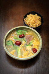 Knee cup soup on the brown table