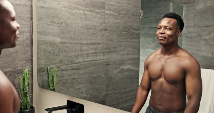 Man, mirror and motivation talking in bathroom for manifestation, positive affirmation and ego boost. Happy black person, body and growth mindset speech in home morning routine for goals reflection