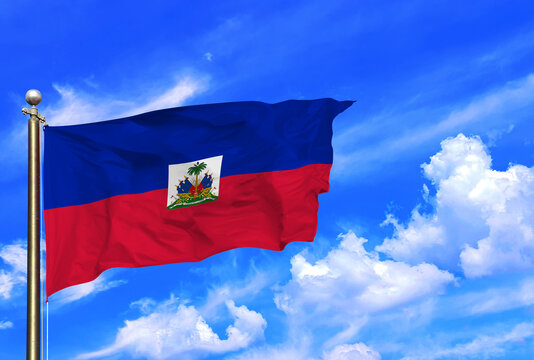 Majestic Flag of Haiti Soaring Under a Clear Blue Sky