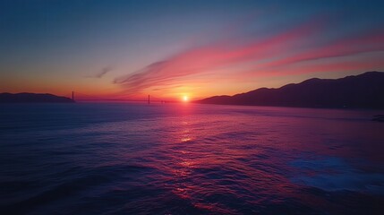 Golden Gate Bridge at sunset, its glowing structure harmonizing perfectly with the vibrant colors of the horizon