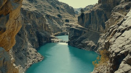Fototapeta premium Turquoise lake nestled in a rocky canyon.