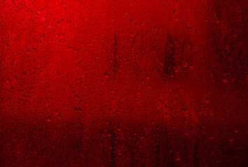 wet red glass. condensation on the glass