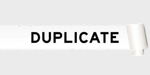 Ripped gray paper background that have word duplicate under torn part