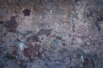 The photo shows the texture of an old concrete wall