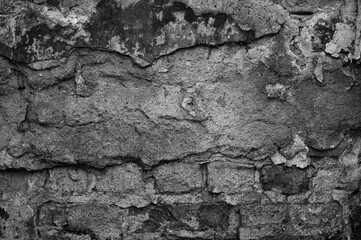 gray brick wall of an old building close up
