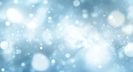 Obraz premium Abstract light blue bokeh background with glowing particles.