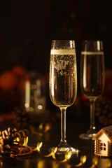 Two glasses with champagne in New Year Eve and Christmas style