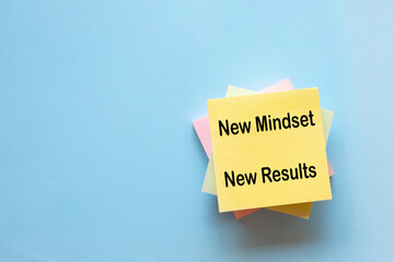New mindset new results text on sticky note idea for Positive thinking,personal growth, success,positivity,personal development, goal setting.
