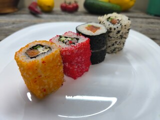 selection of fresh sushi on a white plate.High quality photo