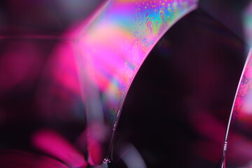 Pink liquid pattern on black background, fluid motion, dark horror background, liquid in macro,...