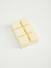 aromatic coconut wax in cubes for use as sachets or in aromatherapy. Photo on a white background