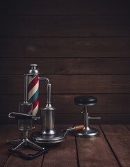 Vintage barber equipment on wood background with place for text, dramatic atmosphere, with white tones