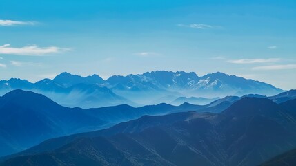Fototapeta premium Majestic mountain range beneath a crystal clear blue sky, capturing the essence of untouched nature and inviting viewers to appreciate the great outdoors and scenic beauty.