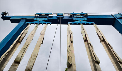 A large blue gantry crane for boats