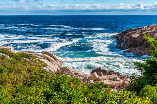 A view over the rocky shoreline at Green cove, Ingonish on the Cabot Trail, Nova Scotia, Canada in the fall - Powered by Adobe
