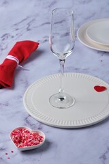 Festive composition for Valentine's Day with dishes and a napkin.