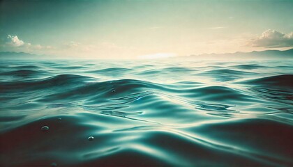 Fototapeta premium A calm ocean water texture with ripples and soft light reflections, in shades of teal and aqua.