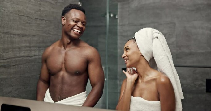 Couple, mirror and happy in bathroom for skincare, spa treatment and fun at holiday resort. Man, woman and excited in reflection with clear skin, shower and dermatology on relationship vacation