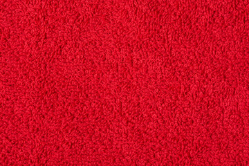 Red terry cloth as a background macro photo.
